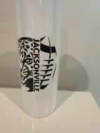 A white cylindrical object with a black and white design featuring a stylized tiger's face and the text "JACKSONVILLE" printed on it.