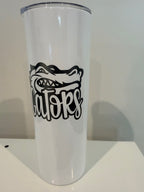 A white cylindrical object with a black graphic design on it.