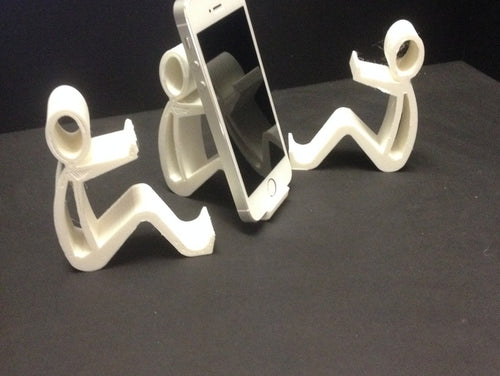 three white, abstract sculptures resembling human figures, each holding a smartphone.