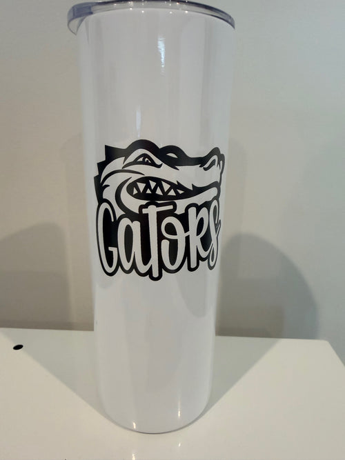 A white cylindrical object with a black graphic design on it.